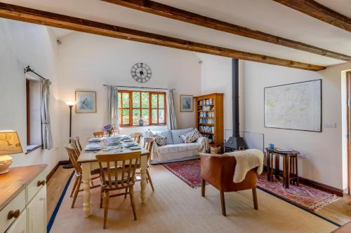 a kitchen and living room with a table and chairs at 2 Bed in Presteigne oc-75066 in Whitton