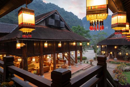a building with chandeliers on top of it at Ui Valley Resort in Ninh Binh