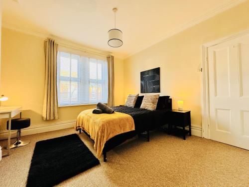 a bedroom with a bed and a window at Park Apartment 2, Close to Tynemouth in Tynemouth