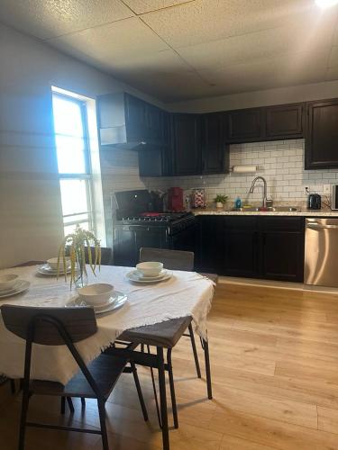a kitchen with a table and chairs and a kitchen with at Superhero Family Home Near Downtown Amarillo in Amarillo