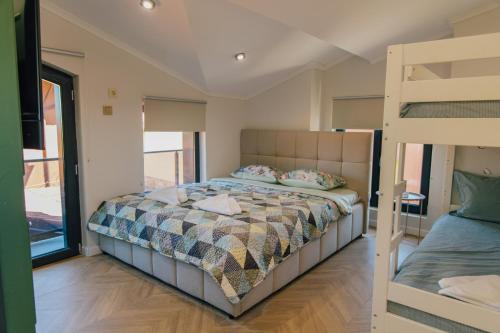 a bedroom with a bunk bed and a ladder at Villa ARTÉ in Shabla