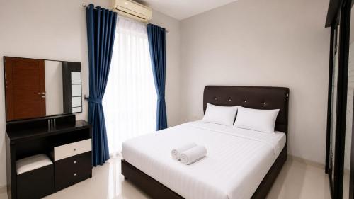 a bedroom with a bed with a mirror and a dresser at SleepRest @ The Home Shoutlink in Nagoya