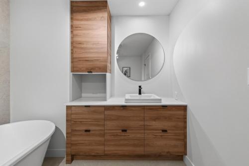 a bathroom with a sink and a mirror at 200-214 - Le Niveau 2 in Beaupré