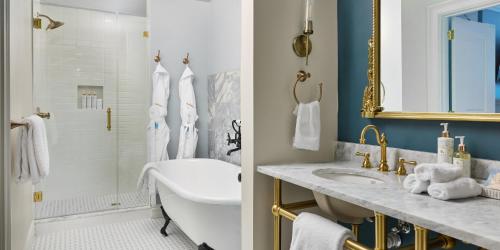a bathroom with a tub and a sink and a shower at Mirbeau Inn & Spa Beacon in Beacon