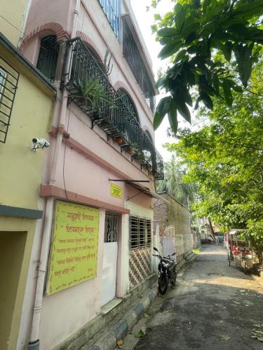 a building with a sign on the side of it at Peaceful Living in Kolkata