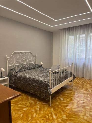 a bedroom with a bed in a room with avisor at Sister House in Cerignola