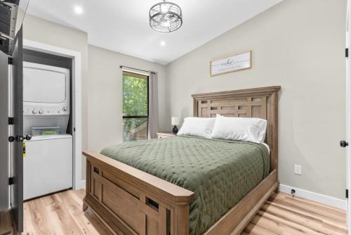 a bedroom with a large bed and a window at Timber and Trail in Kimberling City