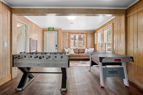 a living room with a ping pong table in it at Pondside Lodge BHBungalows #5 in Custer