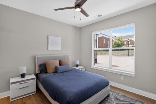 a bedroom with a bed and a window at Parkview Greer 2BR Retreat in Greer
