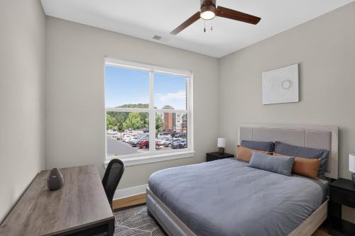 a bedroom with a bed and a window at Parkview Greer 2BR Getaway in Greer