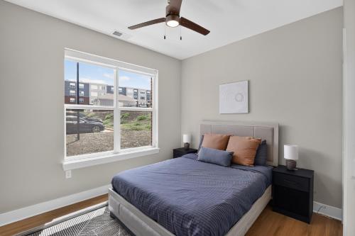 a bedroom with a bed with a ceiling fan and a window at Homey 2BR with Great Space in Greer