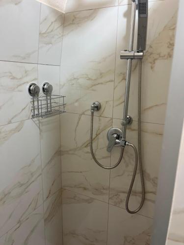 a bathroom with a shower with a glass door at Imperial House in Poggio Imperiale