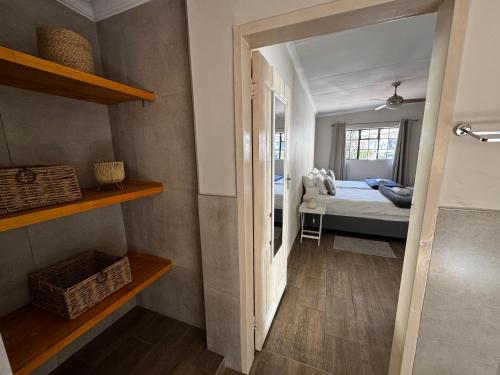 a room with a bedroom with a bed and a window at Family Garden Suite - Sleeps 4 in Pretoria