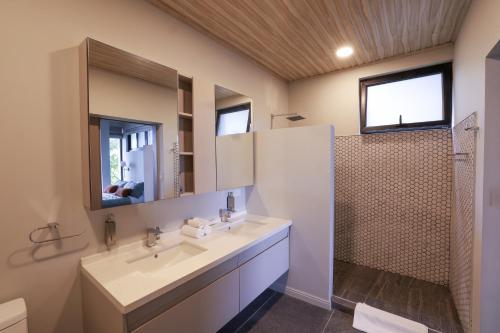a bathroom with a sink and a mirror at Ocean View Villa at Solindo Stays in Marbella
