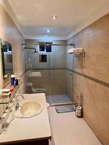 a bathroom with a shower and a sink and a shower at Victory House Mty in Monterrey
