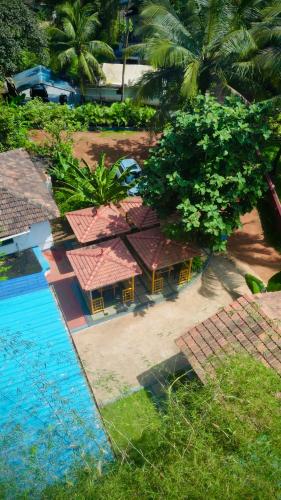 an aerial view of a resort with a swimming pool at Bela Blue Stays in Bardez