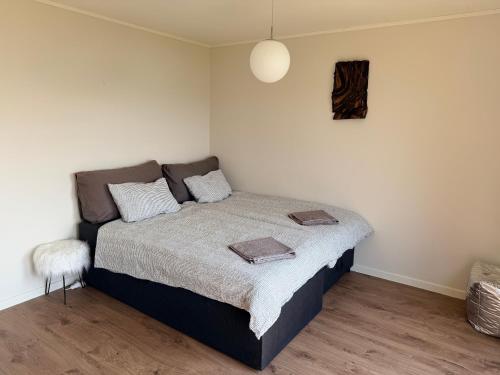 a bedroom with a bed in a room at Panoramic Room with Sea View in Hundsnes