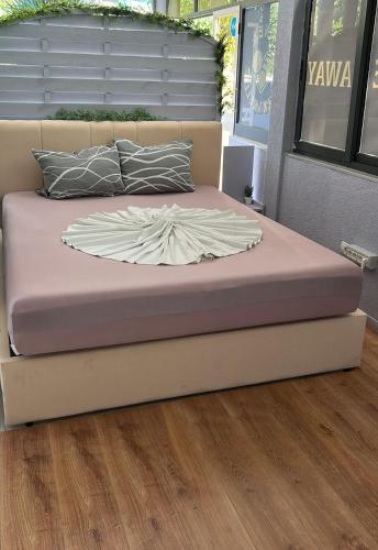 a bed in a room with a bed frame at La Terrazza in Tirana