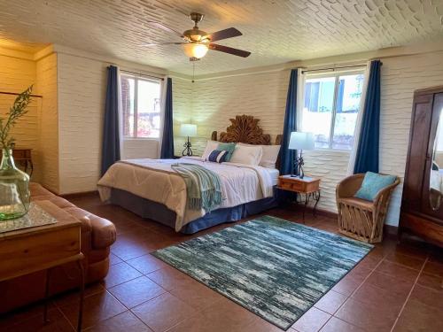 a bedroom with a bed and a ceiling fan at Ocean Front Baja Vacation in Rosarito