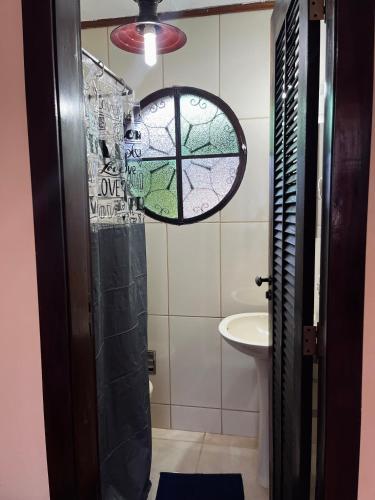 a bathroom with a shower and a sink at Encanto da Serra 2 in Miguel Pereira
