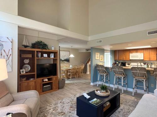 a living room with a couch and a dining room at Egrets Pointe, Unit 492 in Edisto Island