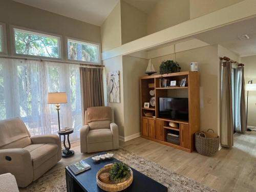 a living room with a couch and a tv at Egrets Pointe, Unit 492 in Edisto Island