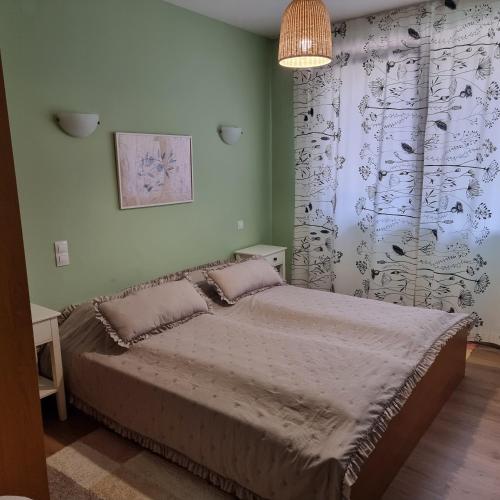 a bedroom with a bed in a room at Apartments Elegance in Bansko