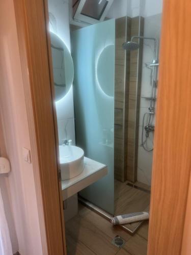 a bathroom with a sink and a shower at Barbara Studios in Skala Potamias