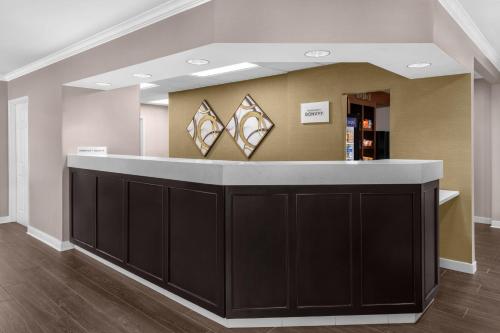 a lobby with a black and white counter with mirrors at Residence Inn by Marriott Albuquerque North in Albuquerque