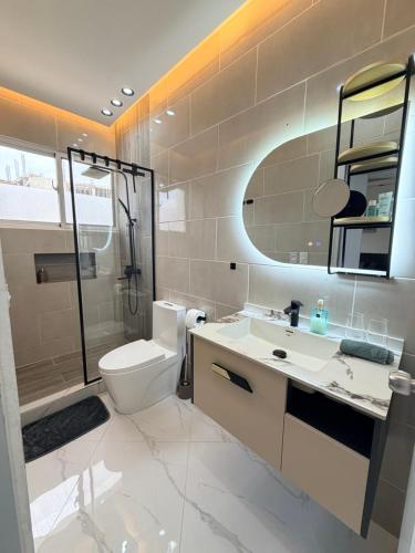 a bathroom with a sink and a toilet and a shower at Luxury NEW Stylish apartment Bayahibe with pool in Bayahibe