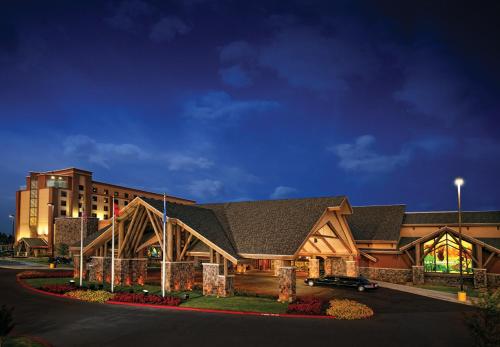 a resort building with a building in the background at Cherokee Casino West Siloam Springs Resort in West Siloam Springs