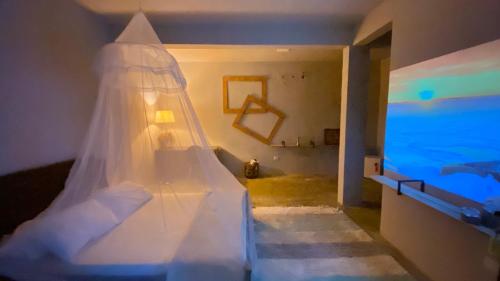 a staircase in a room with a wedding veil at Pousada Refugio da Ilha Ilhabela in Ilhabela