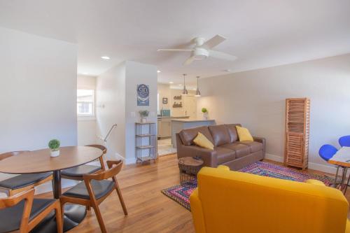 a living room with a couch and a table at Sleeps 10 Walkable to Everything Pets Game Room in Salida
