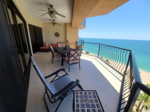 a balcony with a table and chairs and the ocean at Sonoran Sea 2 Bedroom 2 Bath 7th Floor in Puerto Peñasco