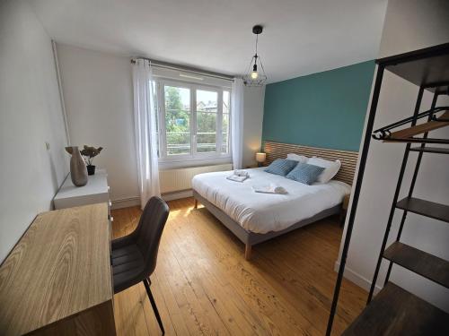 a bedroom with a bed and a window at Atria SILS in Caen
