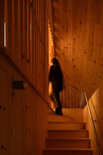 a person walking down stairs in a building at The Down-to-Earth in Rawdon
