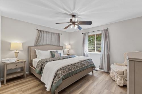 a bedroom with a bed and a ceiling fan at Riverside Harbor House in Post Falls ID in Post Falls