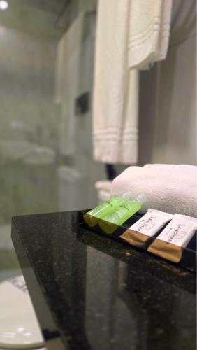 two toothbrushes sitting on a counter in a bathroom at Landmark Residence - OFICIAL in São Paulo