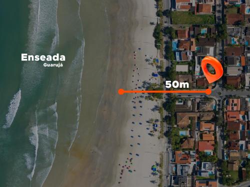 an overhead view of the beach with an orange circle on it at HOSTEL QUINTAL GUEST - Guarujá in Guarujá