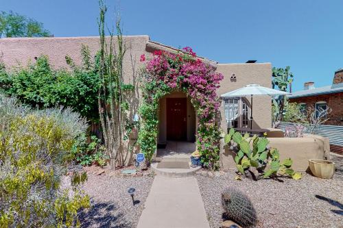 a house with an arch with flowers on it at Historic on 5th in Tucson