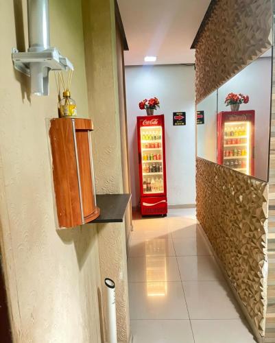 a hallway with two red vending machines in a building at Hotel Santo Amaro inn in São Paulo