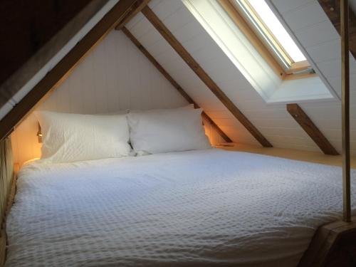 Ένα ή περισσότερα κρεβάτια σε δωμάτιο στο Shepherds Barn