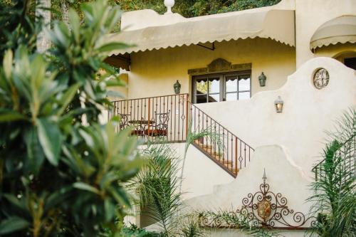 a house with a staircase in front of it at Kenwood Inn & Spa in Kenwood