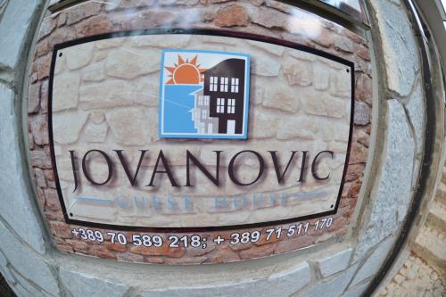 a sign on the side of a parking meter at Jovanovic Guest House in Ohrid