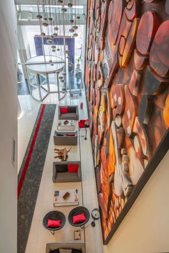 a hallway with a colorful mural on the wall at Meliá Maputo Sky in Maputo
