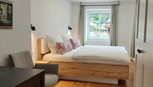 a bedroom with a bed with a window at Ferienwohnung Sofka in Sekull