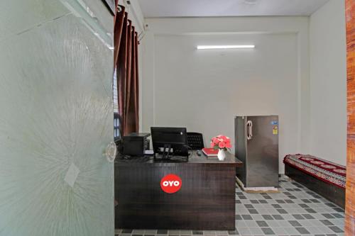 an office with a counter with a stop sign on it at Hotel O Dhurva Inn in Nagpur
