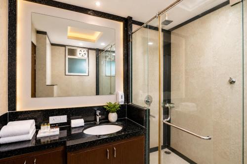 a bathroom with a sink and a shower at Hotel Sawamani - 100 Meters from Khatushyam ji in Khātu