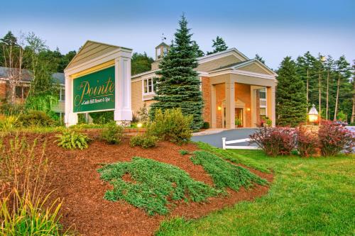 a house with a sign in the front yard at The Pointe at Castle Hill Resort & Spa in Ludlow