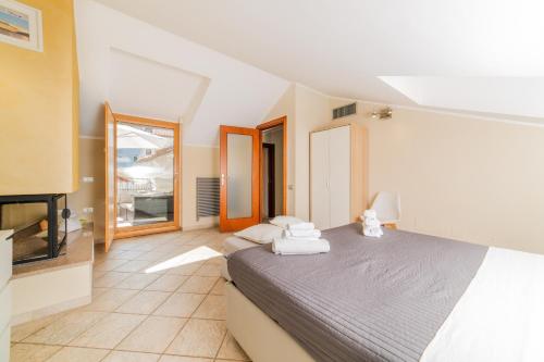 a bedroom with a bed and a flat screen tv at B&B Portanova in Salerno